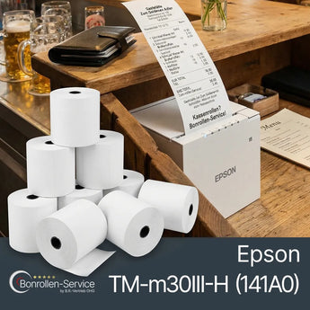 Weiße bondrucker bonrollen neben einem schwarzen epson tm-m30iii-h bondrucker in pyramidenform gestapelt